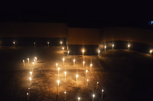 A good night celebration by lighting candles on the roof of the building